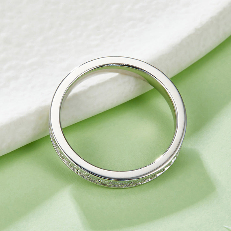 Elegant Women's Sterling Silver Ring with Sparkling Moissanite Inlaid，Unique Design for Fashion Jewelry Lovers.